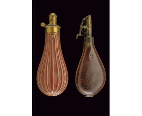 A lot of two powder-flasks dating: mid-19th Century provenance: England Drop-shaped, copper flask with brass fuse and spring,