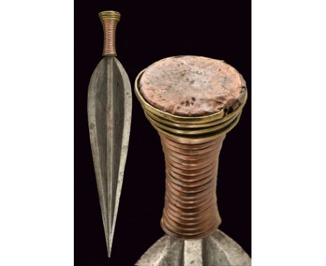 A Lobala dagger dating: circa 1900 provenance: Central Africa Straight, leaf-shaped, double-edged blade, with raiser of recta