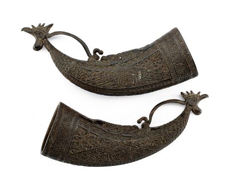 A fine pair of powder-flasks dating: 19th Century provenance: China Curved, horn bodies, richly chiselled, at the base a trip
