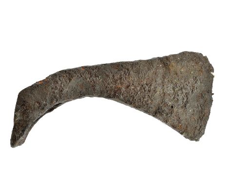 A Viking axe head dating: 11th Century provenance: Northern Europe Iron head, with slightly curved edge, bending toward the s