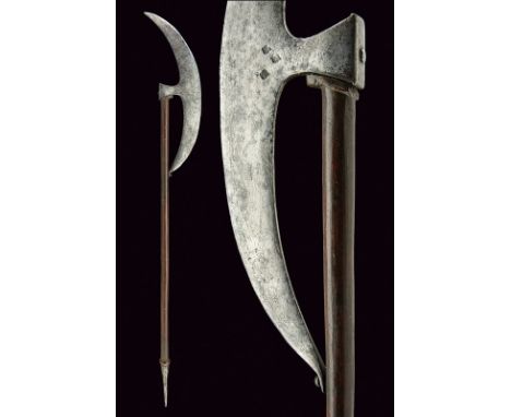 A Bardiche type axe dating: 18th Century provenance: Turkey Long, round, iron head, at the base three Arabic (or Russian) sta