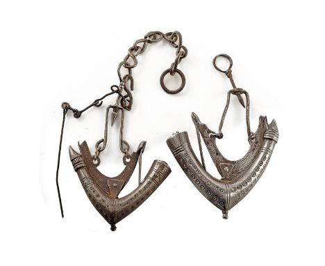A lot of two powder-flasks dating: mid-19th Century provenance: Turkey Curved, iron flask, complete with spring closing syste
