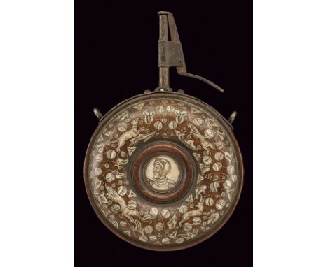 A rare powder-flask dating: 17th Century provenance: Teschen Wooden, doughnut-shaped body, richly decorated with bone inlays 