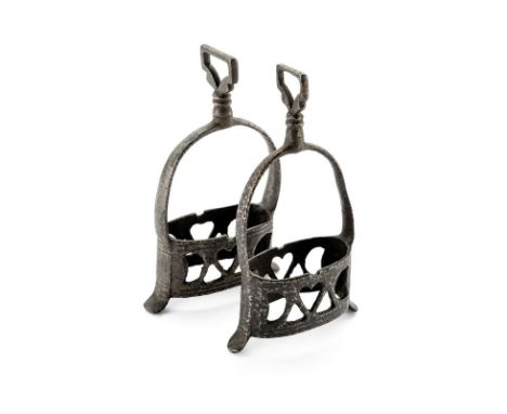 A pair of stirrups dating: circa 1700 provenance: Italy Iron stirrups, with pierced tread, pear-shaped arch with decorated bo