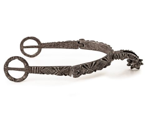 A carved spur dating: 17th Century provenance: Northern Italy Iron spur with articulated heel bands chiselled with geometrica