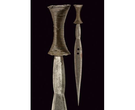 An Azande dagger dating: early 20th Century provenance: Central Africa Pointed and elegant, straight, double-edged blade, sli