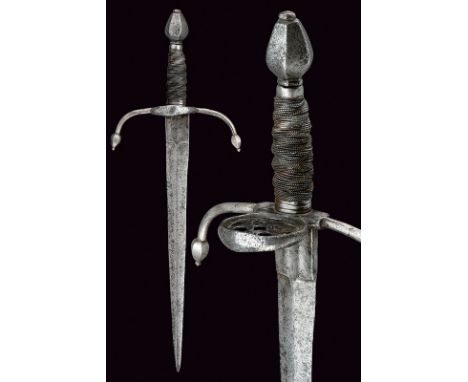A left-hand dagger dating: circa 1600 provenance: Europe Straight blade ribbed at the centre, stamped tang; quillons bent tow