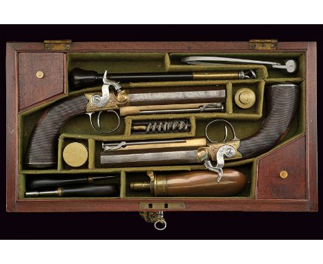 A cased pair of Wilkinson percussion travelling pistols dating: mid-19th Century provenance: London Smooth, octagonal, 13 mm 