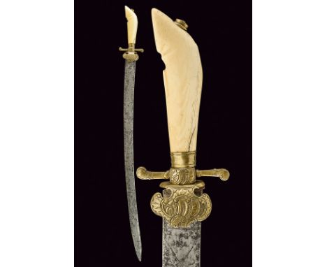A hunting hanger dating: 18th Century provenance: Germany Curved, single -and short false-edged blade, at the forte remains o