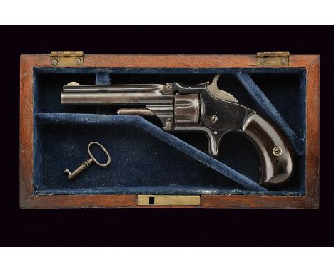 A cased S&W Model No. 1 Third Issue Revolver dating: 1875-1890 provenance: USA Round, rifled barrel, rib with address and pat