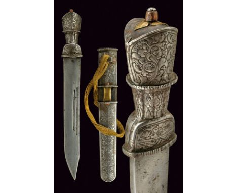 A fine dagger dating: 19th Century provenance: Tibet Strong, straight, single-edged blade with deep grooves; iron-plated grip