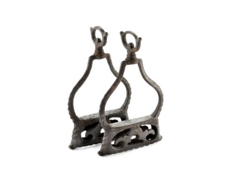 A pair of stirrups dating: circa 1700 provenance: Italy Iron stirrups, with pierced tread, pear-shaped arch with decorated bo