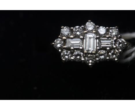 18ct gold diamond cluster ring, the face formed of 15 round and baguette cut diamonds, ring size K