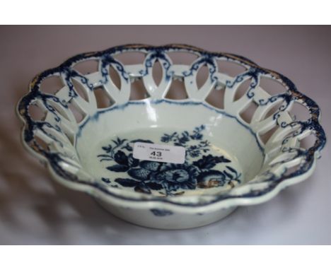 Worcester blue & white printed "Pine Cone Group" deep dish with trellis pattern rim, circa 1775, old repair to rim