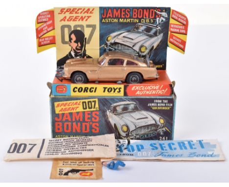 Corgi Toys 261 James Bond Aston Martin D.B.5 from the Film “Goldfinger” gold body, with ejector seat, bandit and James Bond f