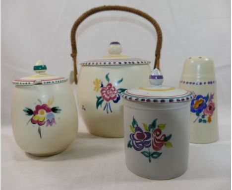 Four pieces of Poole pottery, comprised of a biscuit barrel, 15.5cm high, two lidded conserve jars, 12.5cm high and 11cm high