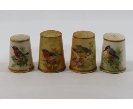 A Victorian Royal Worcester porcelain thimble, hand painted with a bird, a later Royal Worcester example dated 1929, hand pai