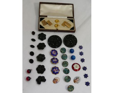 A collection of Victorian and later dress studs and buttons incuding jet, enamel and turquoise examples, two small oval porce