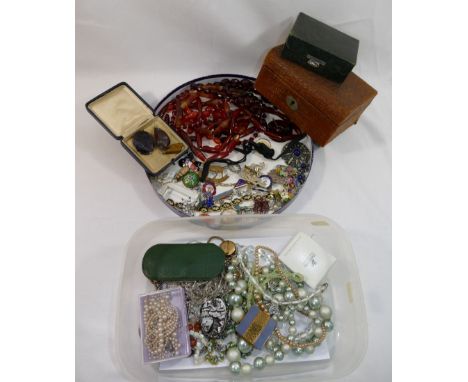 A collection of Victorian and later costume jewellery comprised of faceted banded agate beads, enamel badges, paste set items