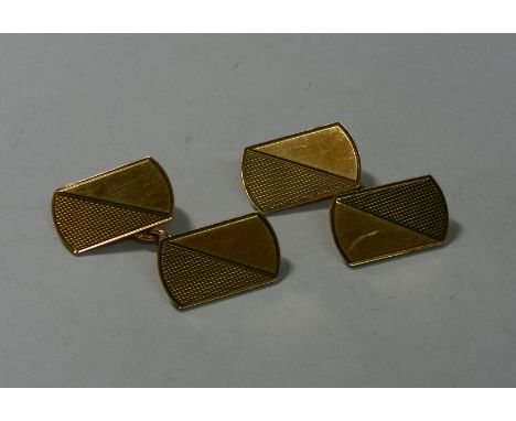 A pair of 9 carat gold cuff links with engine turned decoration, Birmingham 1984, combined weight 6.2g   CONDITION REPORT:  I