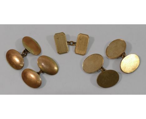 Two pairs of 9 carat gold oval cuff links, Birmigham 1963, with engine turned decoration and Birmingham 1914, and one other 9