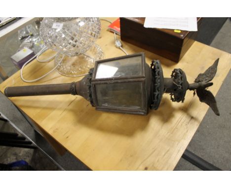 A VINTAGE BRASS COACH LAMP WITH BIRD FINIAL