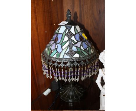 A SMALL TIFFANY STYLE LAMP