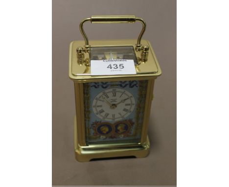 A HALCYON DAYS LIMITED EDITION ENAMEL COMMEMORATIVE CARRIAGE CLOCK WITH KEY