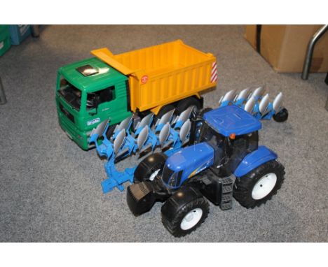 A COLLECTABLE 'BRUDER' LORRY, TRACTOR & PLOUGH