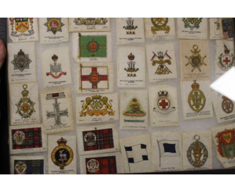 A SET OF VINTAGE CASED MILITARY SILKS