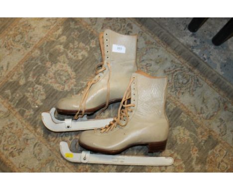 A PAIR OF VINTAGE ICE SKATES