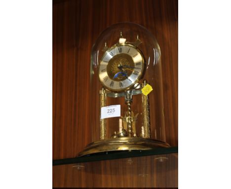 A MOON ROLLER ANNIVERSARY CLOCK WITH GLASS DOME
