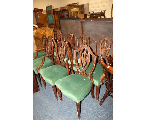 A SET OF TEN UPHOLSTERED CHIPPENDALE STYLE DINING CHAIRS