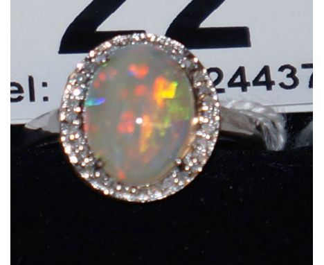 Good white gold opal and diamond set ring - Estimate £150 to £250