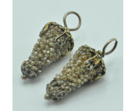 A pair of 19th Century Victorian earring / pendant drops having a cluster of seed pearls with yellow metal and enamel mounts 