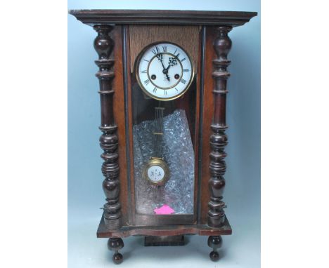 A Victorian 19th century walnut Vienna regulator 8 day wall clock by Gustav Becker. Drop pendulum with enamel face and roman 