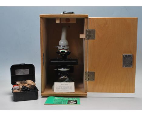 A vintage late 20th century USSR - OMO model C11 scientific laboratory biological microscope No. 815370 complete with lenses,