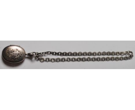 A 19th Century Victorian antique silver hallmarked locket and collar necklace having a gate linked chain with a large oval lo