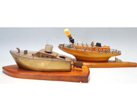 A pair of vintage mid century nautical interest desk lamp / table lights in the shape of fishing boats. One of wooden constru