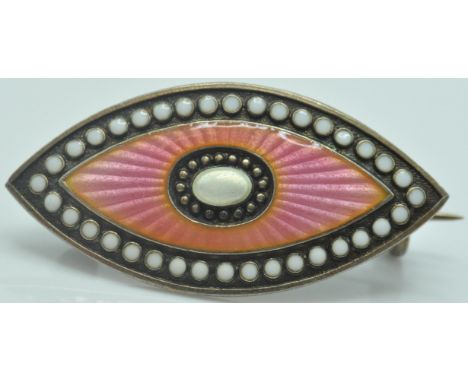 An early 20th Century Edwardian brooch of navette form having pink guilloche enamel with white enamelled details with a hinge