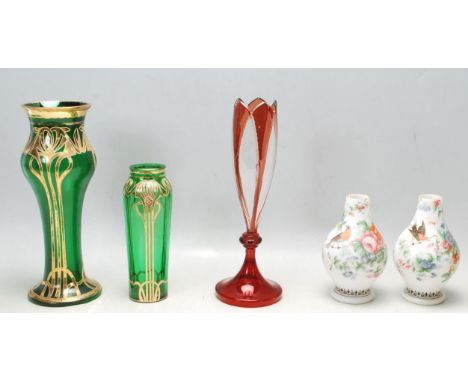 A collection of antique and Art Nouveau coloured glass items to include Bohemian ruby glass, two green and gilt Art Nouveau v
