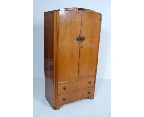 A vintage mid century oak veneer Austinsuite wardrobe / bachelor wardrobe having domed top, twin doors above two long drawers