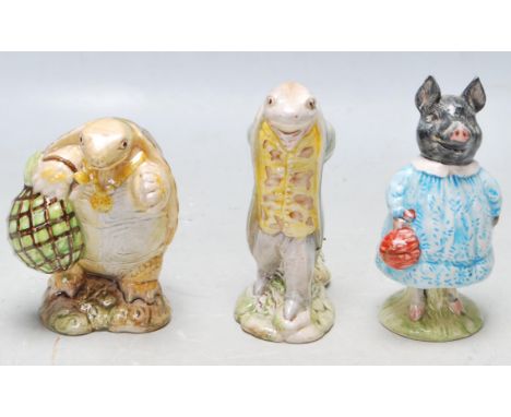 A group of three Beswick Beatrix potter ceramic figurines to include Sir Isaac Newton, Mr Alderman Ptolemy and Pig-Wig. Talle