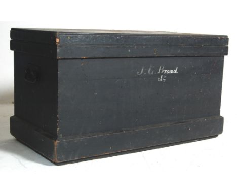 A late 19th century Victorian ebonised blanket box / travel trunk of a rectangular form with hinged lid opening to reveal a f