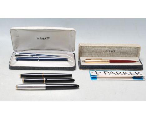 A collection of vintage late 20th century Parker pens comprising of a boxed Parker 65 pen with paperwork, Parker 51 button fi