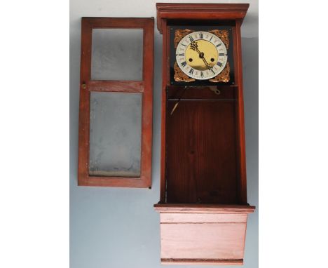 An early 20th century Edwardian wall clock having a white enamel clock face, roman numerals to the chapter ring, cherub spand