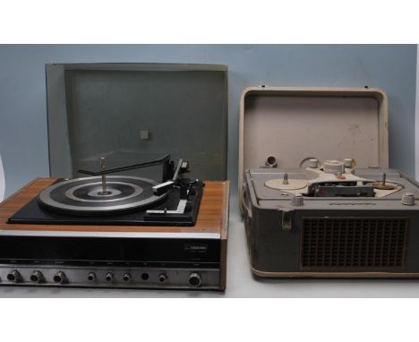 A vintage 1970’s Ferguson Unit Audio turntable / record player / radio tuner having brushed aluminium front with silver and b