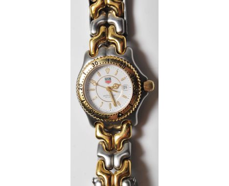 A Tag Heuer professional 18ct gold plated stainless steel ladies wrist watch. Water resistant to 200m with rotating watch bez