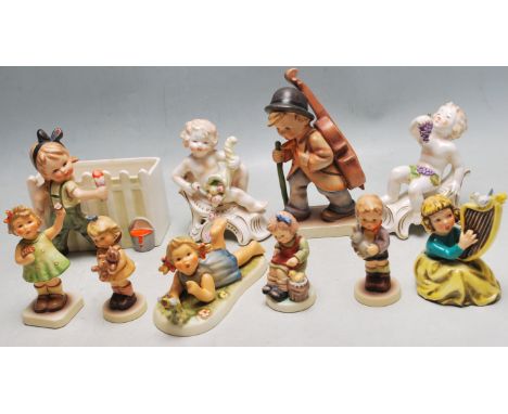 A collection of x12 original vintage Hummel / Goebel (and style) made ceramic figurines - some in boxes, others unboxed. Incl