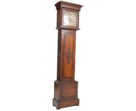 A 19th century George III brass faced longcase clock having spandrel embellishments to the corners. The grandfather clock has